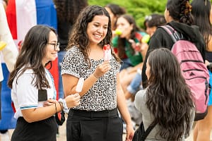 Decorative image of students at a cultural celebration