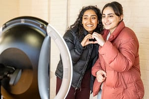 Decorative image of two people taking a selfie