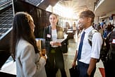 Decorative photo of three students at an internship fair.